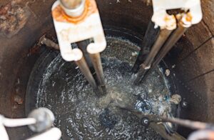 Looking down into a lift station with grease buildup